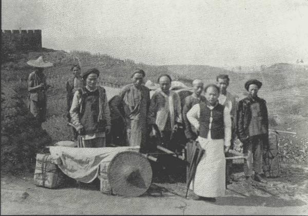 AUTHOR'S MODEST CARAVAN IN SZECH'UAN

And a fine body of men they were, kept in order by the general factotum
in the foreground—each of them earning about 25 cents a day.