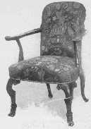 An elaborately carved Chippendale chair, with late Queen
Anne influence in the shape of the back. Petit point covering which was
so popular in her day is now wonderfully reproduced.