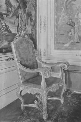 One of a set of three rare Louis XIV chairs, beautifully
 carved and gilded, and said to have belonged to the great Louis himself.