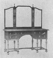 In this walnut dressing-table the period of William and
Mary has been adapted to modern needs.