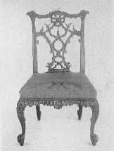 Two important phases of Chippendale's work&mdash;an elaborate
ribbon-back chair, and one of the more staid Gothic type.
