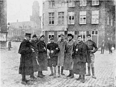 WITH A GROUP OF BELGIAN OFFICERS AT FURNES, BELGIUM, 1914.
ONE OF THEM USED TO ACT AS MY COURIER