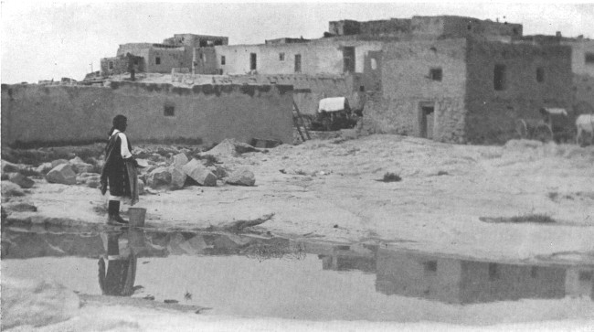 At the water hole on the outskirts of Laguna, one of the
pueblos in New Mexico