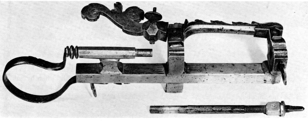 Figure 5.&mdash;Spring for keeping the follower spindle
against the work, showing the method and range of adjustment. Note the
rectangular projection to engage a mating socket in the spindle, to
prevent spindle rotation. (Smithsonian photo 46525.)