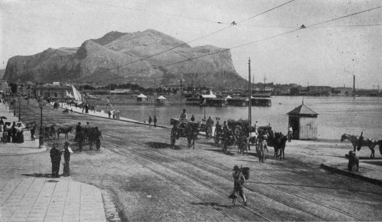 Monte Pellegrino looms square and massive at one tip of
Palermo’s crescent harbor.