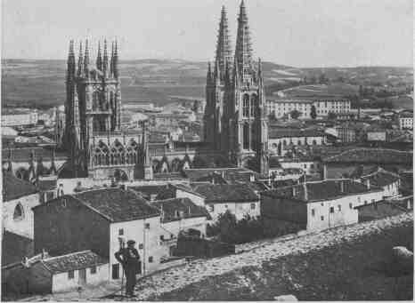 05 the Iron-gray Bulk of The Cathedral Rears Itself from Clustering Walls and Roofs