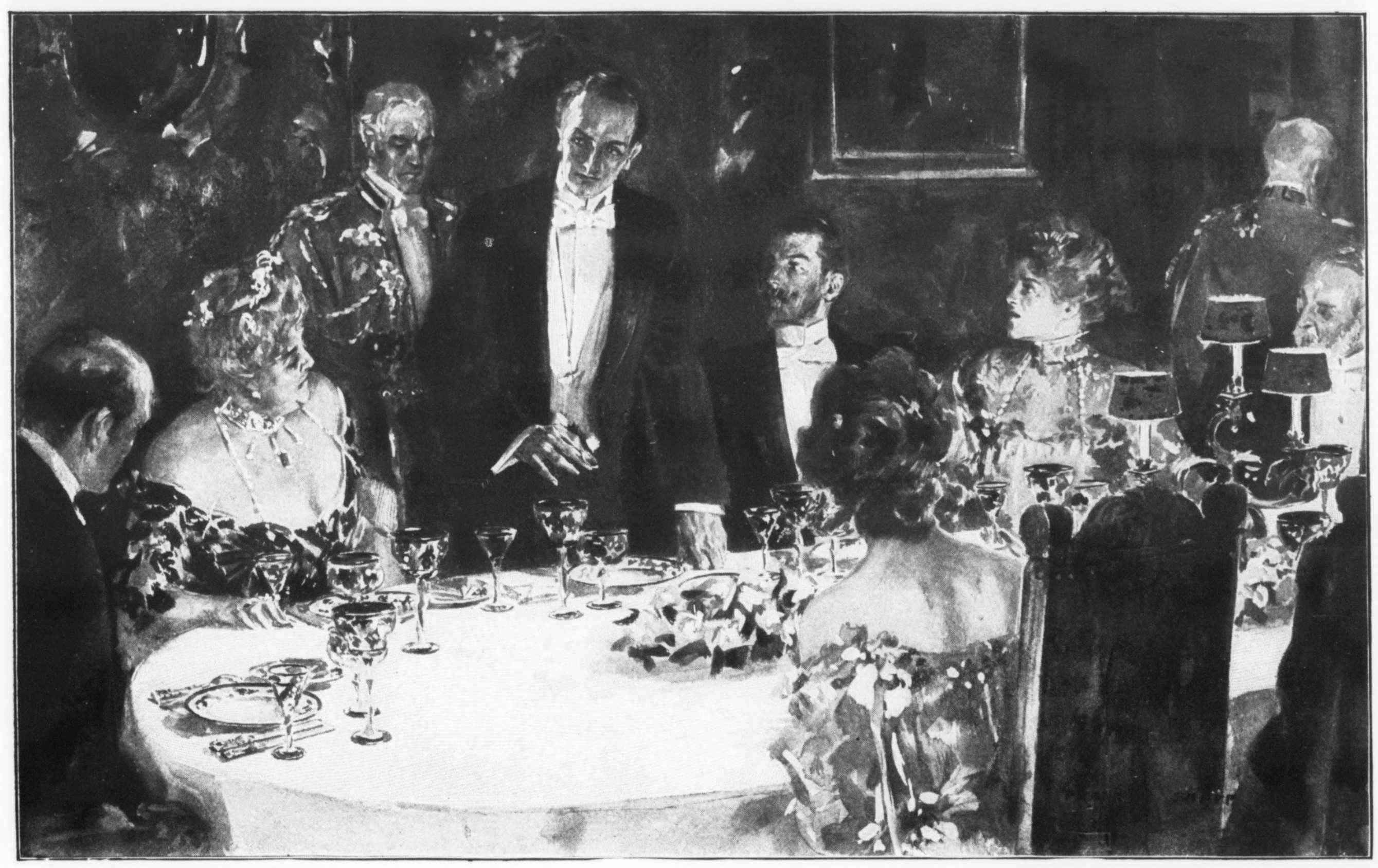 man standing at a dinner table